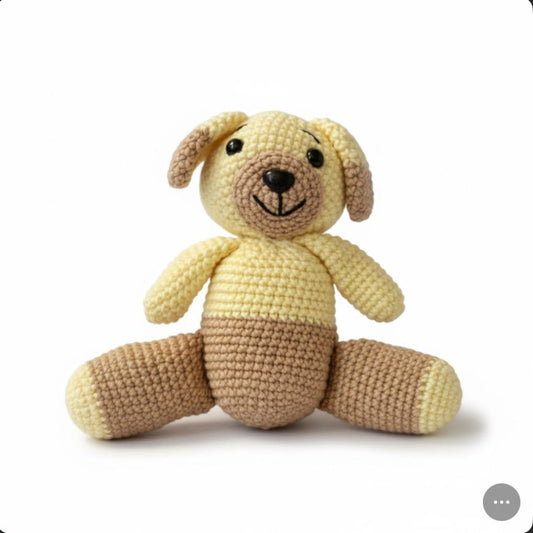 Crocheted dog toy with a smiling face on a white background